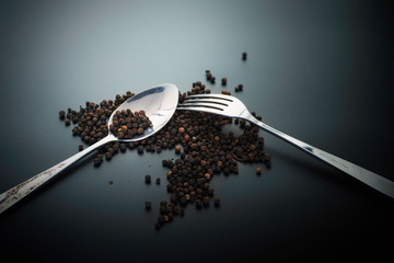 Fork and spoon on dark background, Restaurant concept. soft focus in the middle.