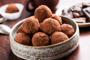 Vegetarian Chocolate Truffles With Raw Cocoa And Dates. Closeup View Of Pile Of Homemade Chocolate Truffles. Chocolate Energy Balls
