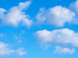 White clouds on a blue sky background