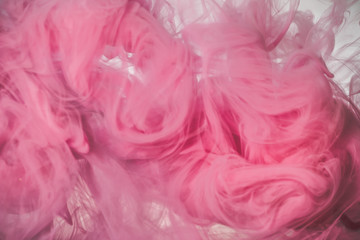 Fototapeta premium Pink color explosion. Colorful ink in water. Abstract background
