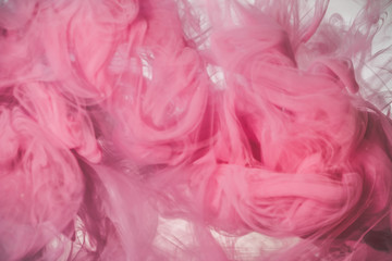 Pink color explosion. Colorful ink in water. Abstract background