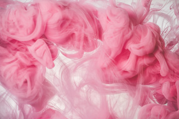 Fototapeta premium Pink color explosion. Colorful ink in water. Abstract background