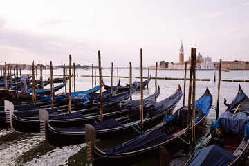Fototapeta na wymiar Panoramic view of Laguna Veneta coast of Venice city with gondolas