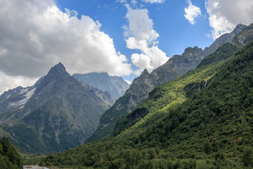 Fototapeta na wymiar Panorama view on mountains scene in national park of Dombay, Caucasus