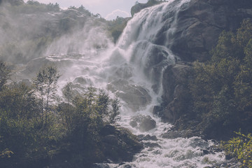 Panorama view of waterfall scene in mountains, national park of Dombay, Caucasus
