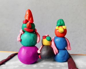 multi-colored snowmen from plasticine.