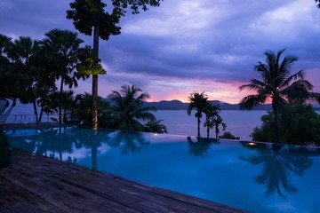 Sunset in the sea reflex with swimming pool