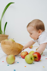 Fototapeta premium Image of Baby play with apple at home