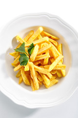 Top view of Fries or French Fries on White Restaurant Plate Isolated