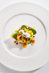 Exquisite serving avocado with mozzarella cream and dried tomato jam