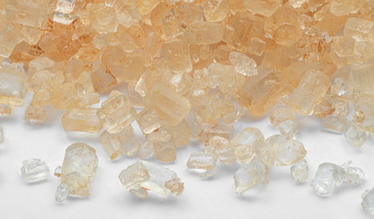 Macro Photo of Pile of Brown Sugar on White Floor