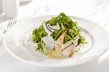 Gourmet, restaurant, delicious dinner food - close up of Salad with Quail Wings and Parmesan Cheese