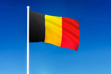 Waving flag of Belgium on the blue sky background