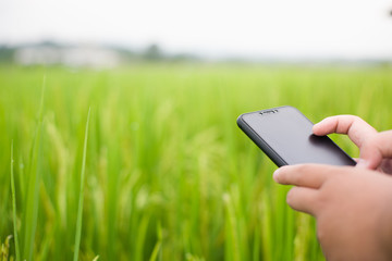The hand of a man carrying a business phone