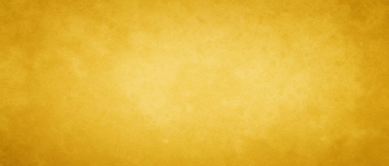 Gold or yellow vintage background texture with old grunge borders and soft blended paint center, studio backdrop in elegant luxury colors