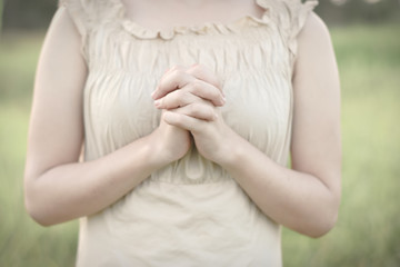 The woman's hand is praying