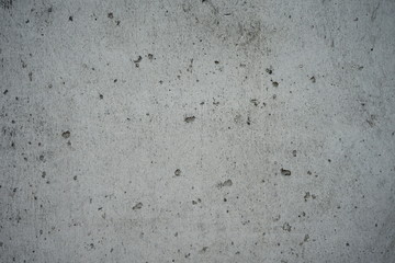 Concrete surface There are bubbles from pouring concrete into a small hole.