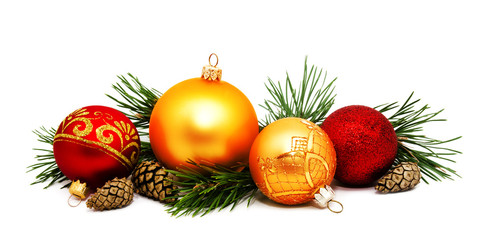 Christmas decoration golden yellow and red balls with fir cones and fir tree branches isolated