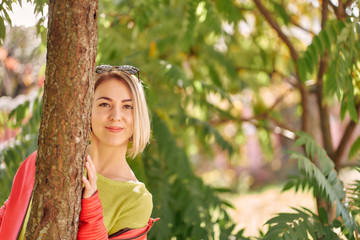 Fototapeta premium close-up young woman in autumn park