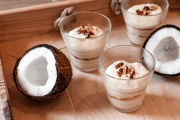 Coconut tender dessert in cafe. Dessert in glass for Valentine's day.