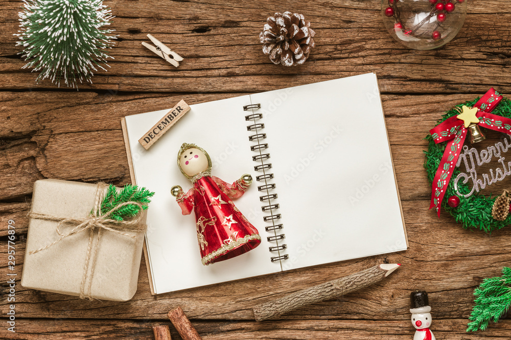 Aufkleber top view of blank notebook on grunge wood background with xmas decorations. mockup christmas backgro