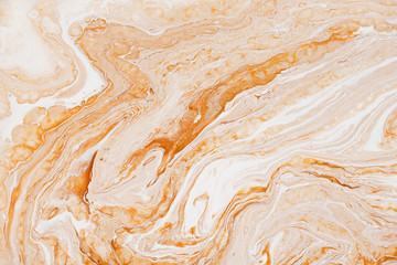 Caramel dynamic and fluid raster texture. Abstract acrylic paints mixt color background. Dyeing, liquid flow surface modern design. Orange and white contrast pigments, watercolor wallpaper.