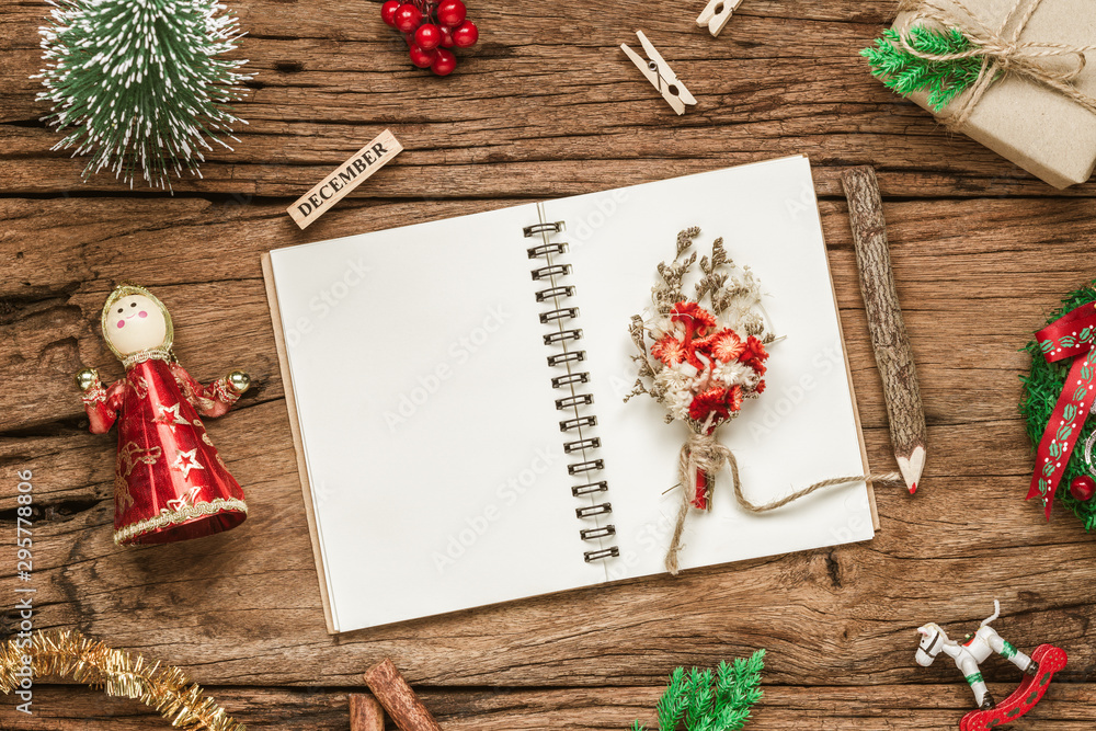 Aufkleber top view of blank notebook on grunge wood background with xmas decorations. mockup christmas backgro