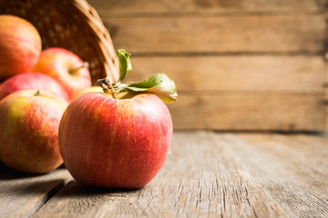 Freshly harvested ripe apple on the rustic wooden background. Selective focus. Shallow depth of...