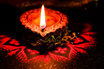 Diwali decoration with traditional earthen lamps and rangoli