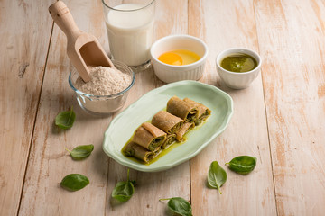 crepes with pesto sauce and ingredients