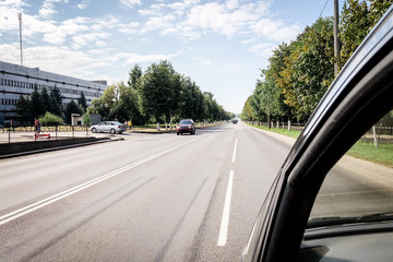 View on road from car window.