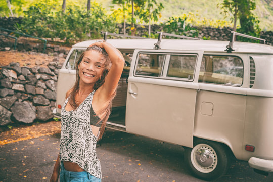 Camper van road trip Asian young woman happy relaxing on summer travel vacation in Hawaii. Retro vintage campervan caravan car.