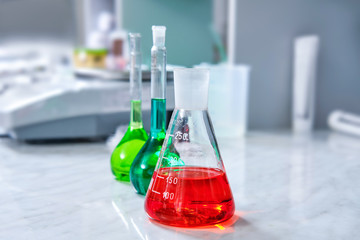 Chemical flask with liquid solution in laboratory