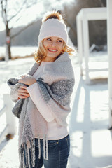 young blonde woman in a winter park