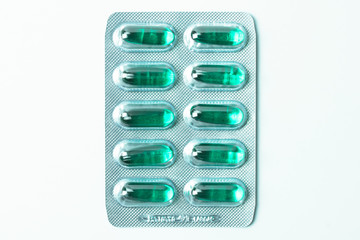 soft gelatin medicine pill capsule blister on white background