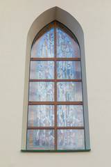 Stained glass arched window of church