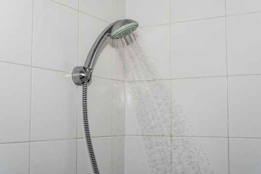 Close up of Water flowing from shower in the bathroom