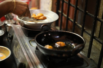Woman preparing snacks at kitchen