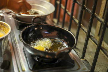 Onion bajji, deep fried onion bhajis in a home kitchen