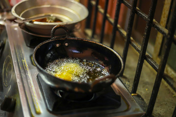 Onion bajji, deep fried onion bhajis in a home kitchen