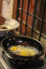 Onion bajji, deep fried onion bhajis in a home kitchen