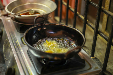 Onion bajji, deep fried onion bhajis in a home kitchen