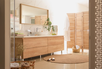 Modern bathroom interior with vessel sink and big mirror