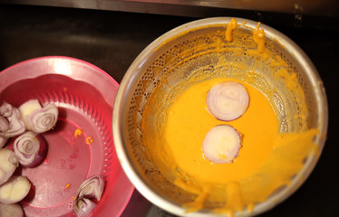 Top view of Onion Bhajji is a spicy Indian snack of chopped onions fried in dough