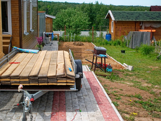 building materials in the yard of a rural house, Russia.
