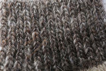 Knitted soft woolen sock as background, closeup