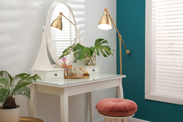 Dressing table with mirror in stylish room interior