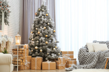 Room interior with decorated Christmas tree and gifts near window