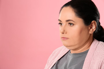 Woman with double chin on pink background. Space for text