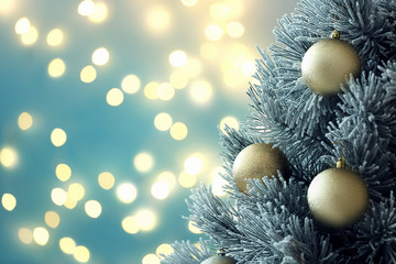 Decorated Christmas tree against blurred lights on background, space for text. Bokeh effect